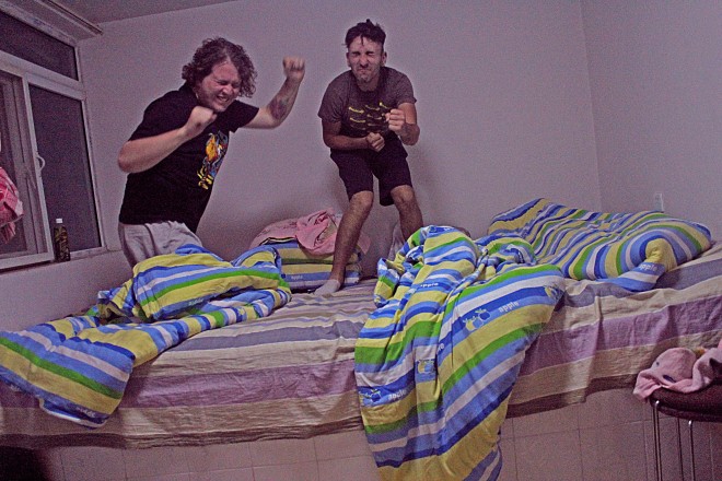 Jumping on the kang bed as Rachel sleeps.
